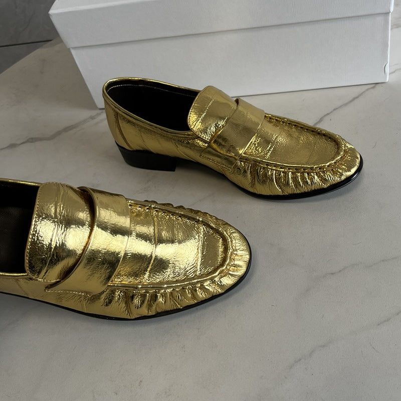 Eel skin loafers for women by Rossie Viren, showcasing stylish slip-on shoes with sleek eel skin texture and elegant design.