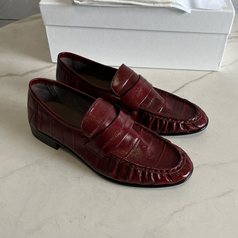 Eel skin women's loafers by Rossie Viren featuring sleek design and natural eel leather texture.