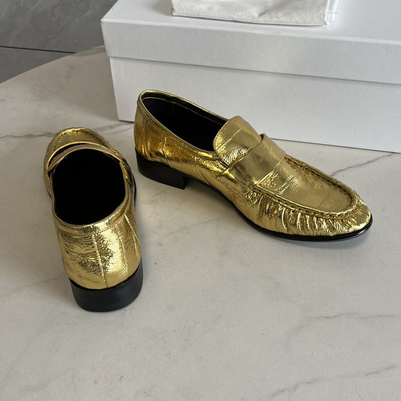Eel skin loafers for women by Rossie Viren, showcasing stylish slip-on shoes with a sleek eel skin texture.