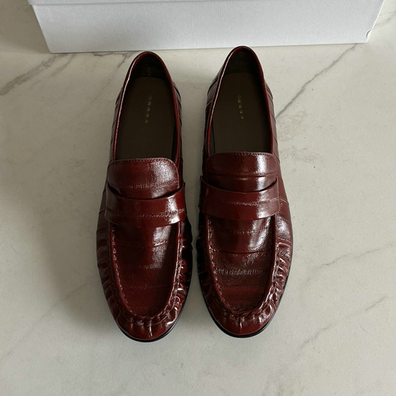 Eel skin loafers for women by Rossie Viren, showcasing stylish slip-on shoes with textured eel skin material.