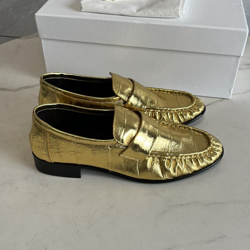 Eel skin women's loafers by Rossie Viren, showcasing sleek black shoes with a smooth finish and stylish design.