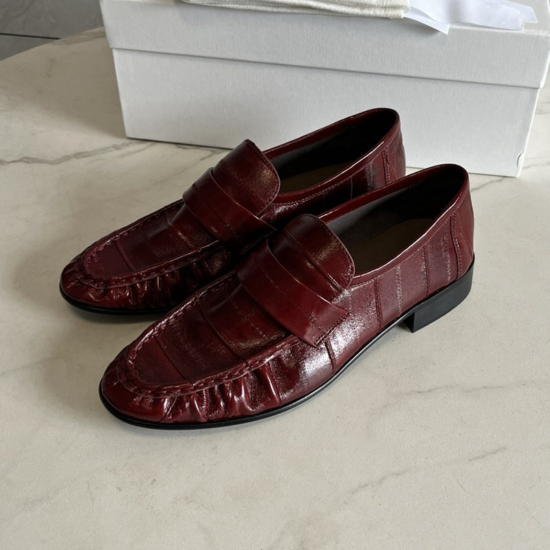 Eel skin loafers for women by Rossie Viren, featuring sleek design and smooth eel leather material, perfect for stylish casual wear.