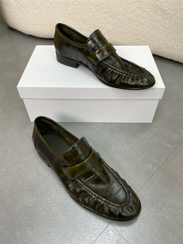 Eel skin loafers for women by Rossie Viren, showcasing sleek eel skin shoes with a stylish slip-on design.