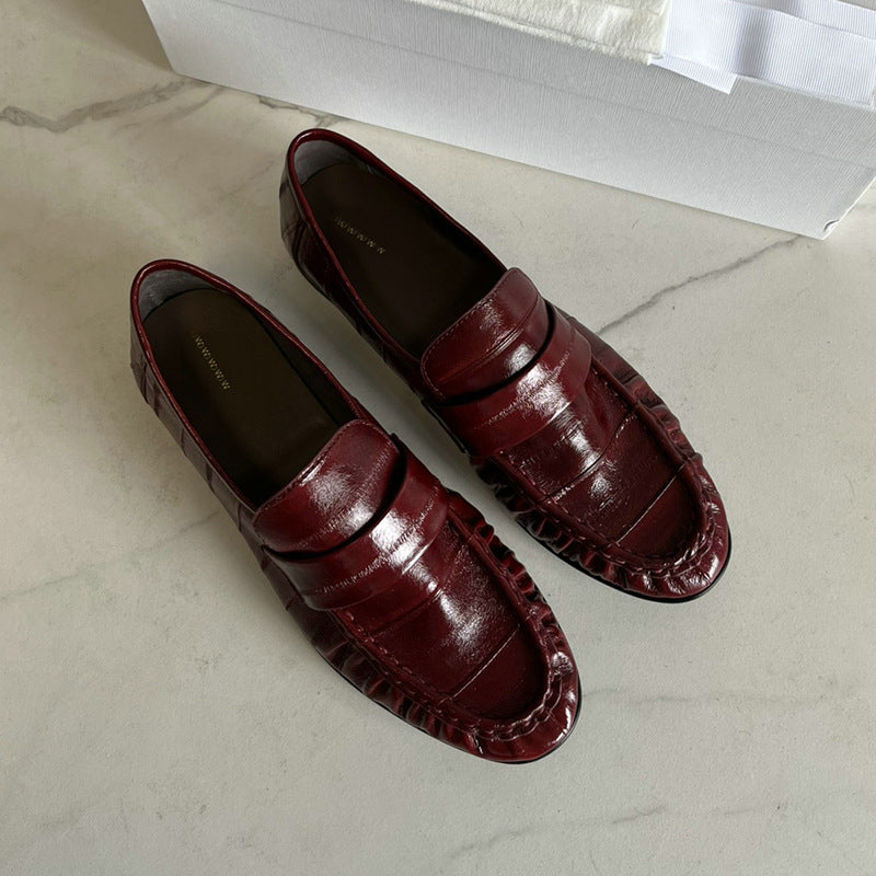 Eel skin women's loafers by Rossie Viren featuring sleek design and smooth texture, perfect for stylish and comfortable footwear.