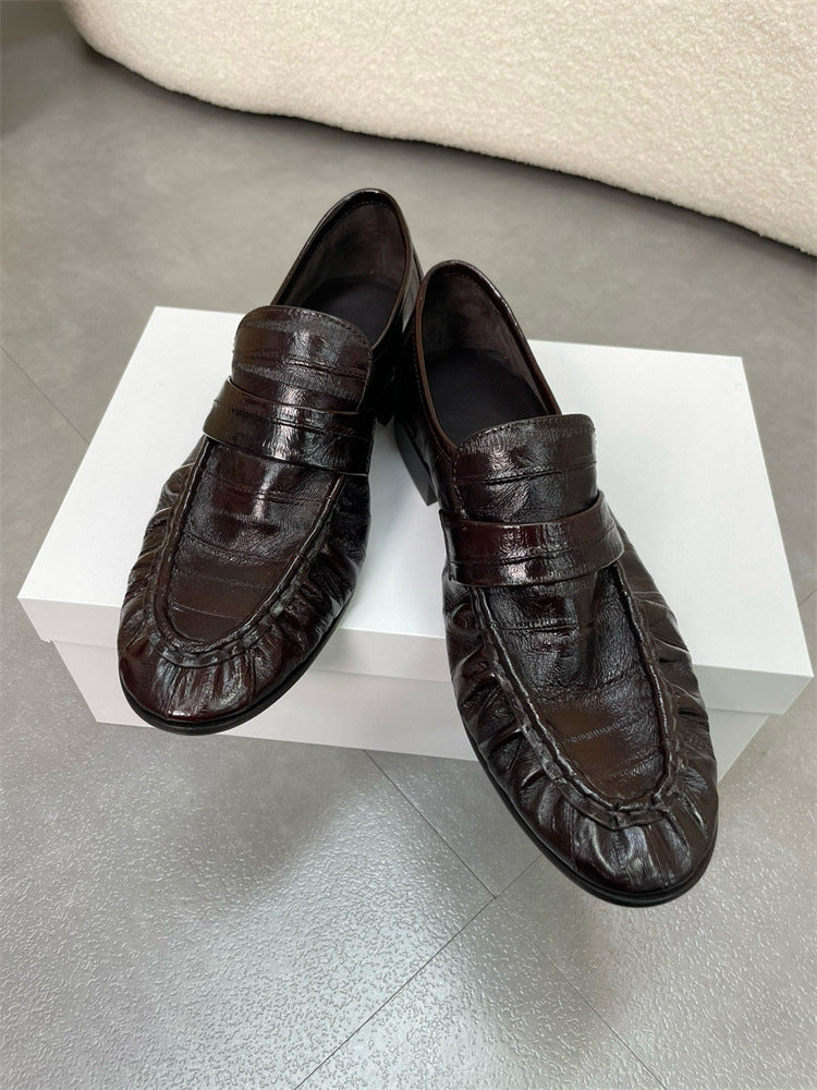 Eel skin women's loafers by Rossie Viren featuring sleek, textured leather with classic slip-on shoe design.
