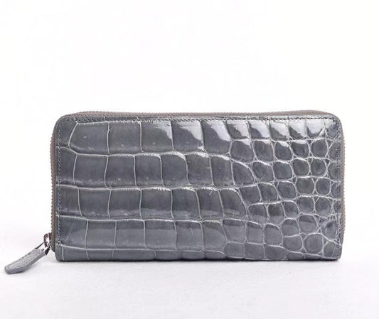 alt
Portafogli con zip in vera pelle di coccodrillo lucida