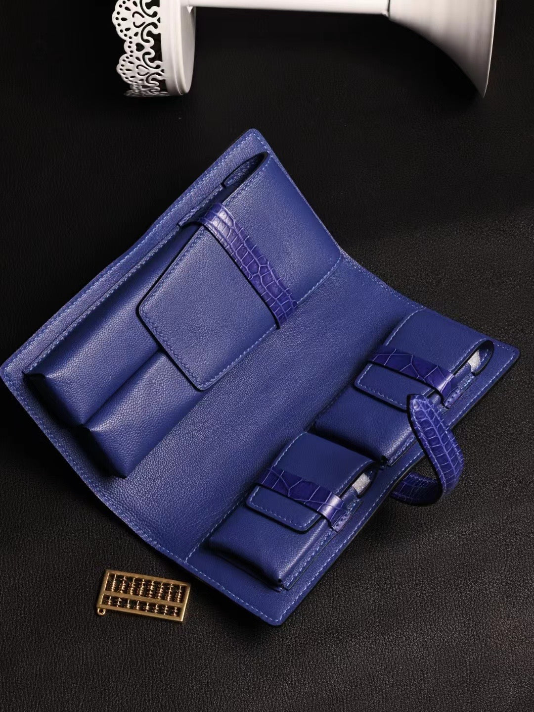 Genuine crocodile leather Rossie Viren cigar bag card holder with textured crocodile pattern and sleek design.