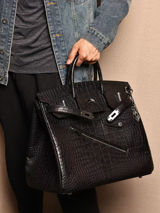 alt
Borsa grande da uomo con manico superiore in pelle di coccodrillo nera