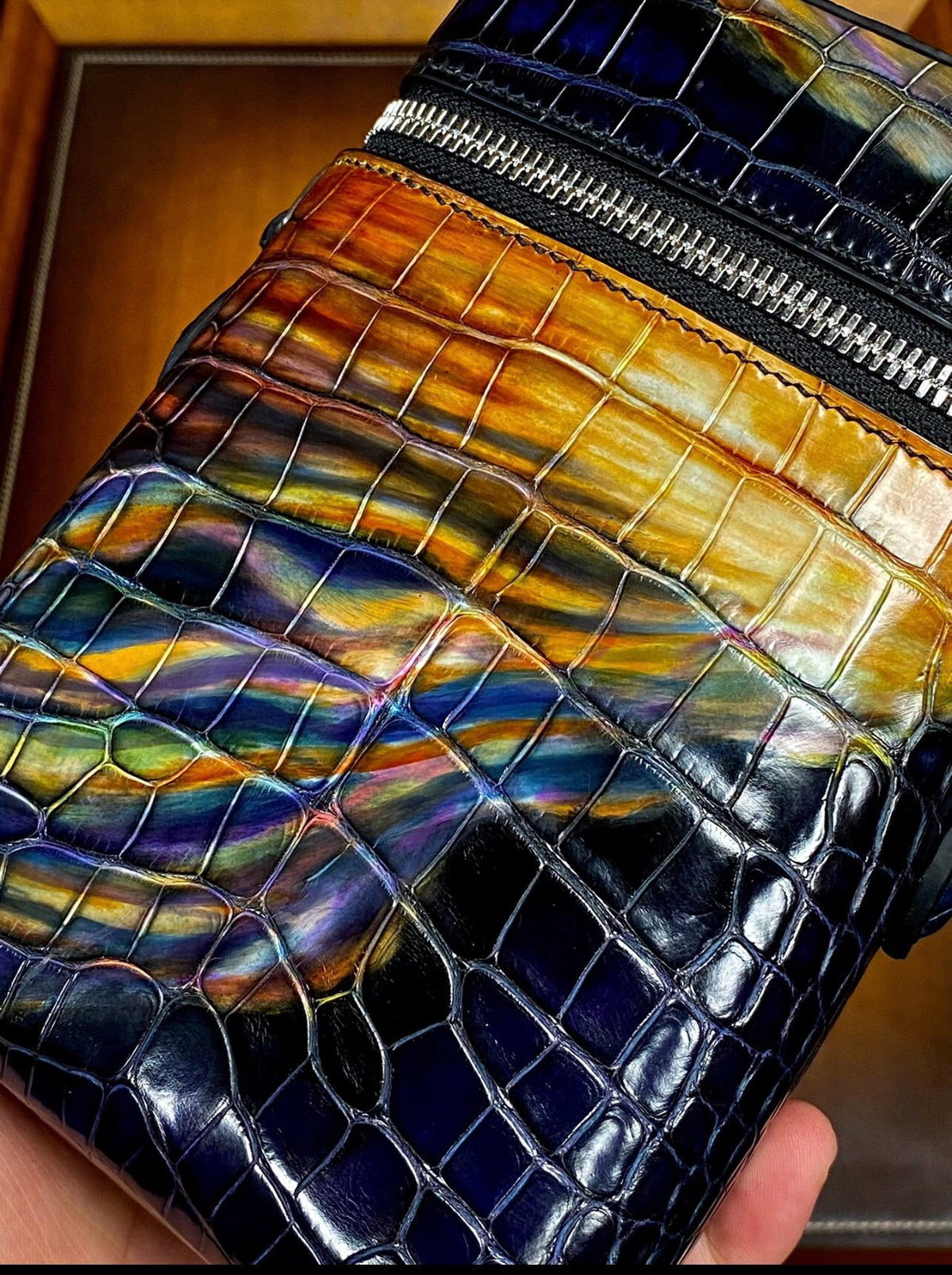 Rossie Viren genuine crocodile leather clutch bag designed for camera and phone storage with a sleek, luxurious appearance.