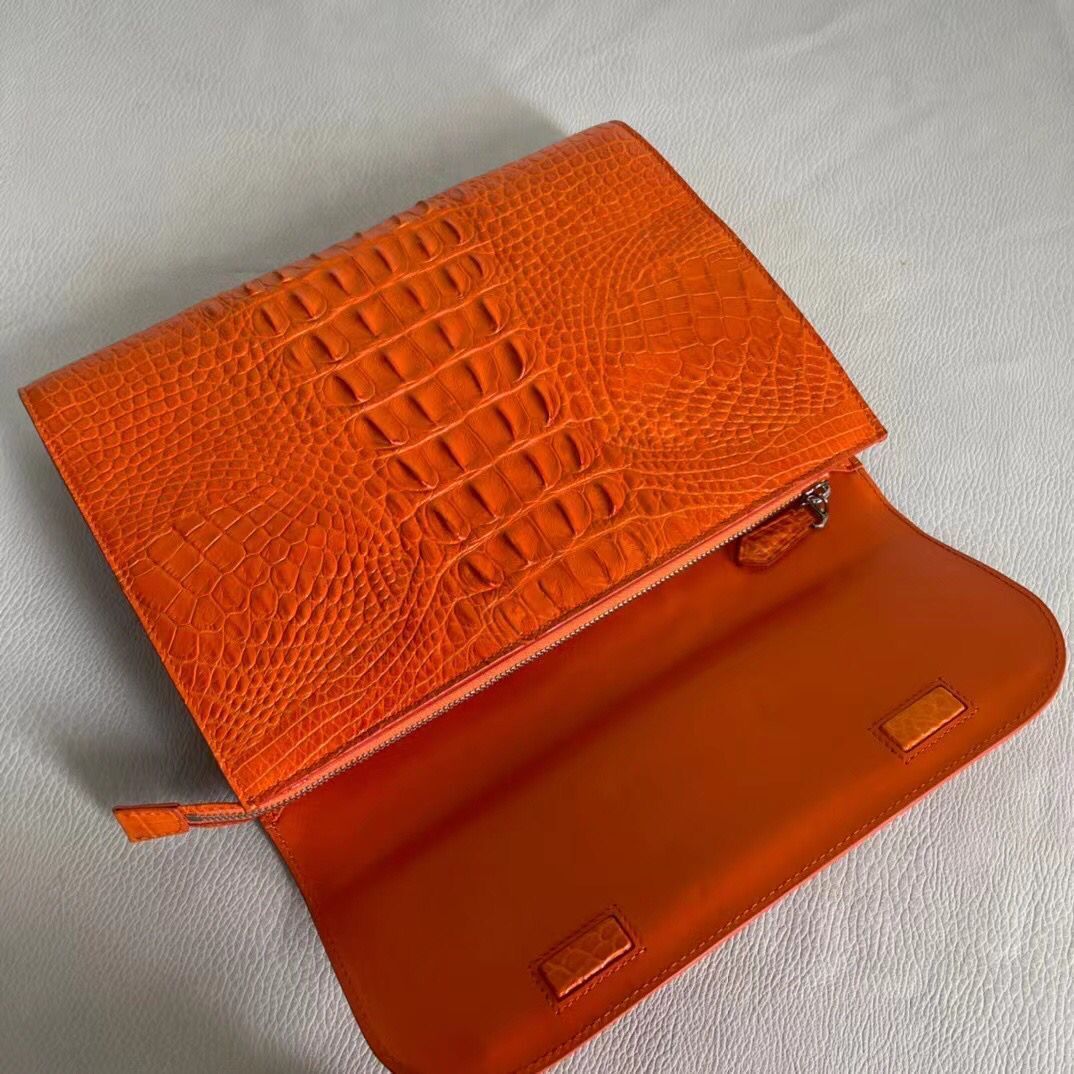 Women’s genuine crocodile leather clutch by Rossie Viren, featuring a sleek card holder design with textured crocodile pattern.
