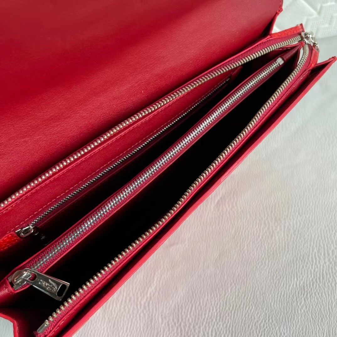 Women's genuine crocodile leather clutch card holder by Rossie Viren, showcasing a sleek, textured crocodile pattern.