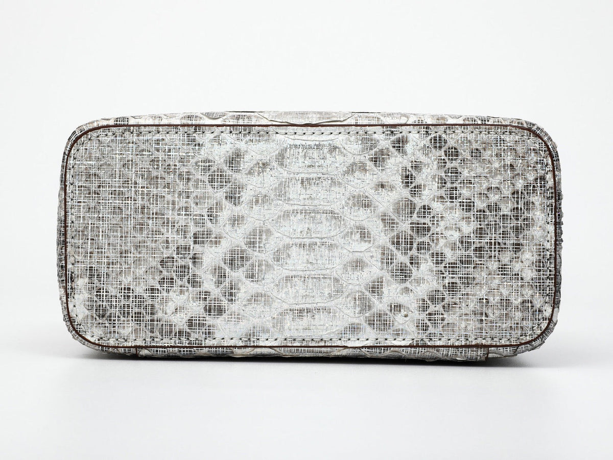 Women's Python leather cross-body handbag with top handle by Rossie Viren, featuring a compact cosmetic bag design.